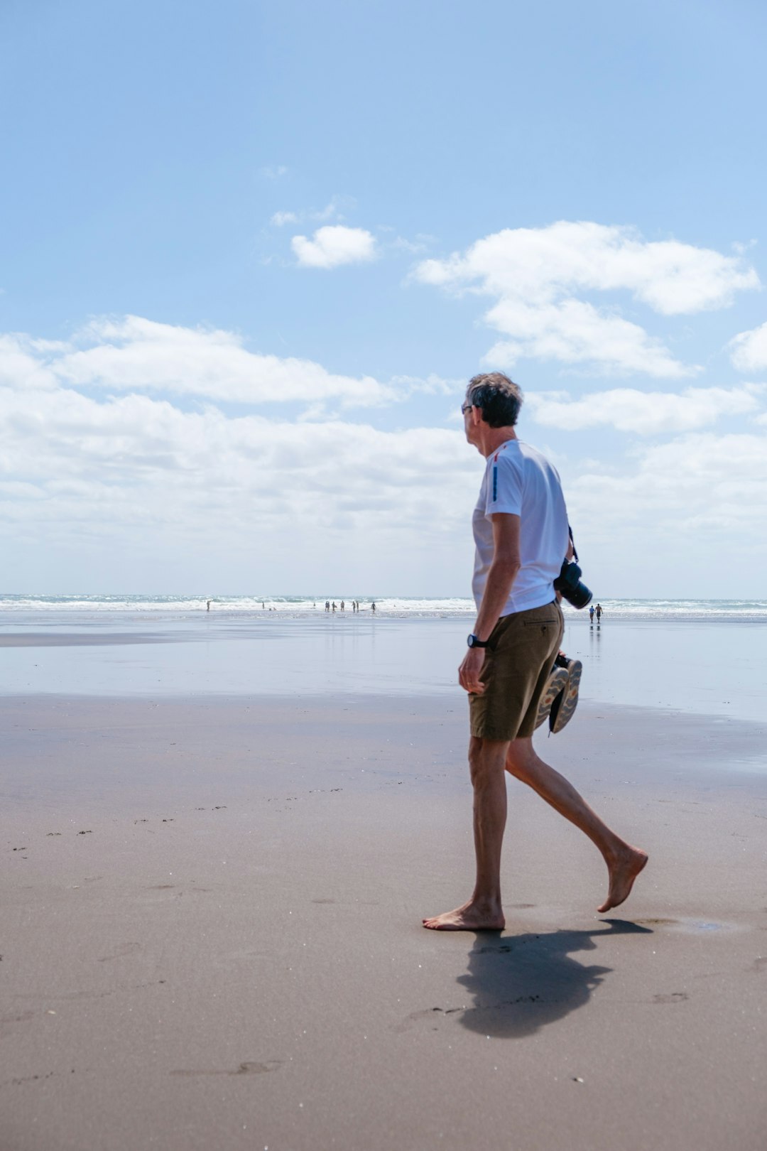 actor walking by the sea